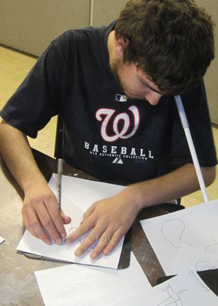 A student drawing on the Sensational BlackBoard