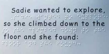 Braille text and a raised numeral